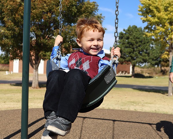 st-monica-boy-playing-on-swing