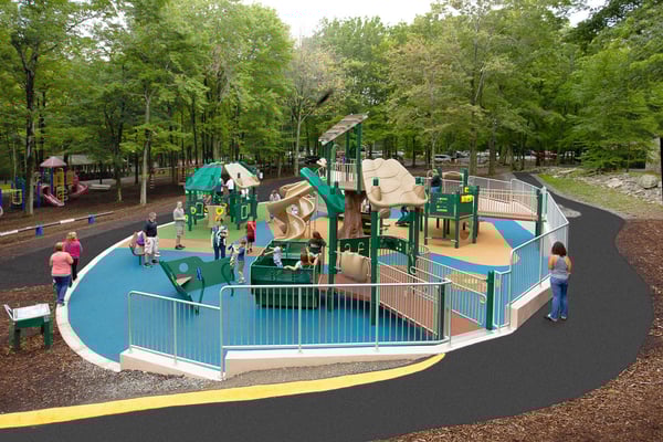 aerial shot of children playing on a large green and tan colored park