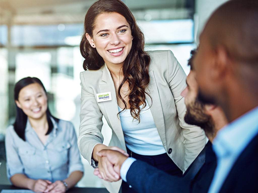 Play & Park Structures employee shaking hands with business partner