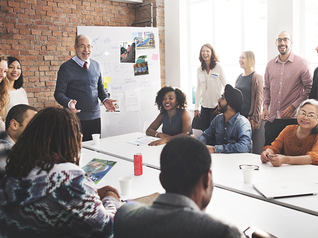 Group of diverse colleagues meeting at a conference table