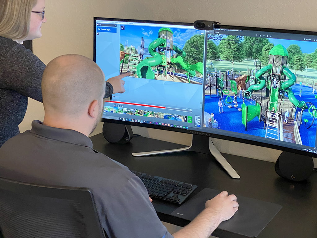 man and woman working on computer building a playground