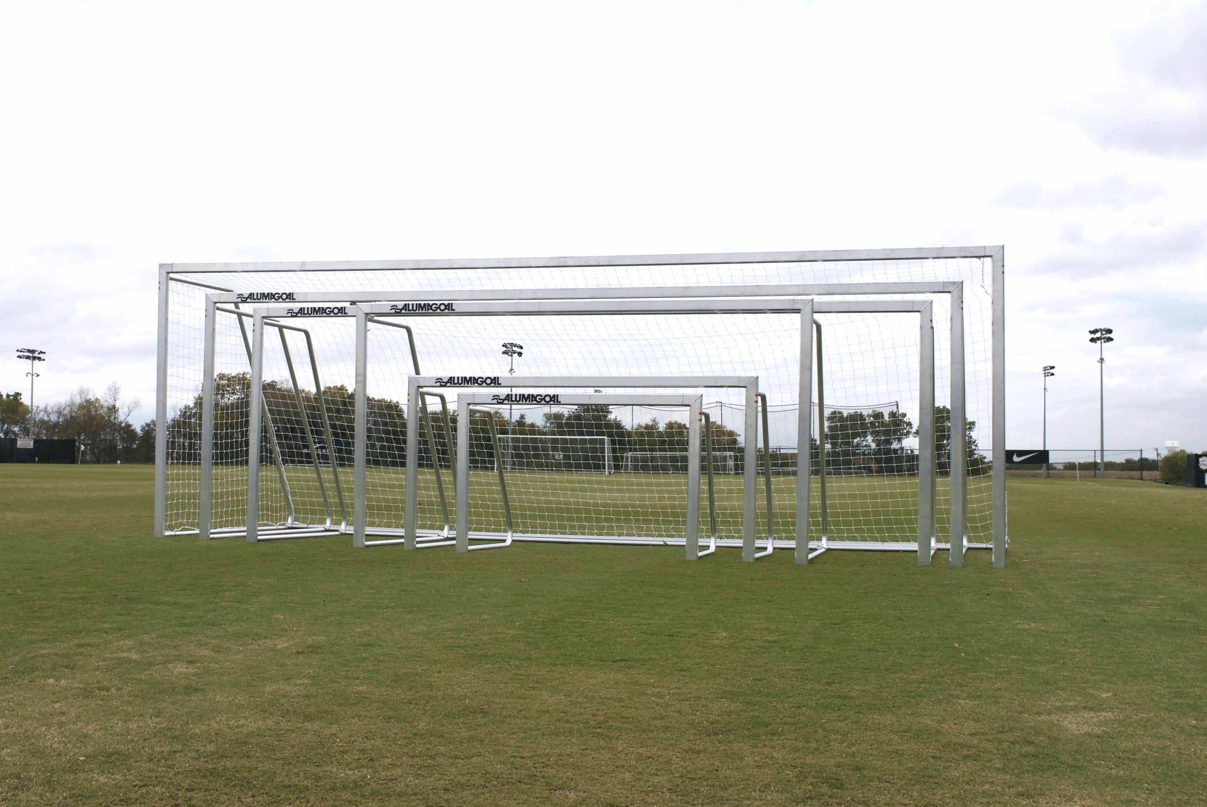several silver soccer goals inside of one another  
