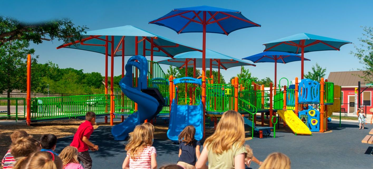 children running towards blue colored park with 3 covers during summer