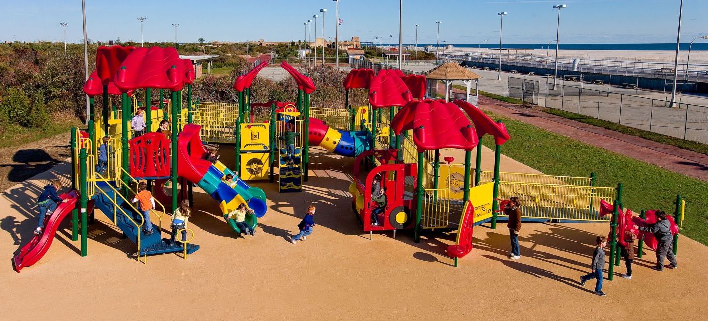 Featured image of aerial shot of red and yellow colored park brown turn and children playing on it