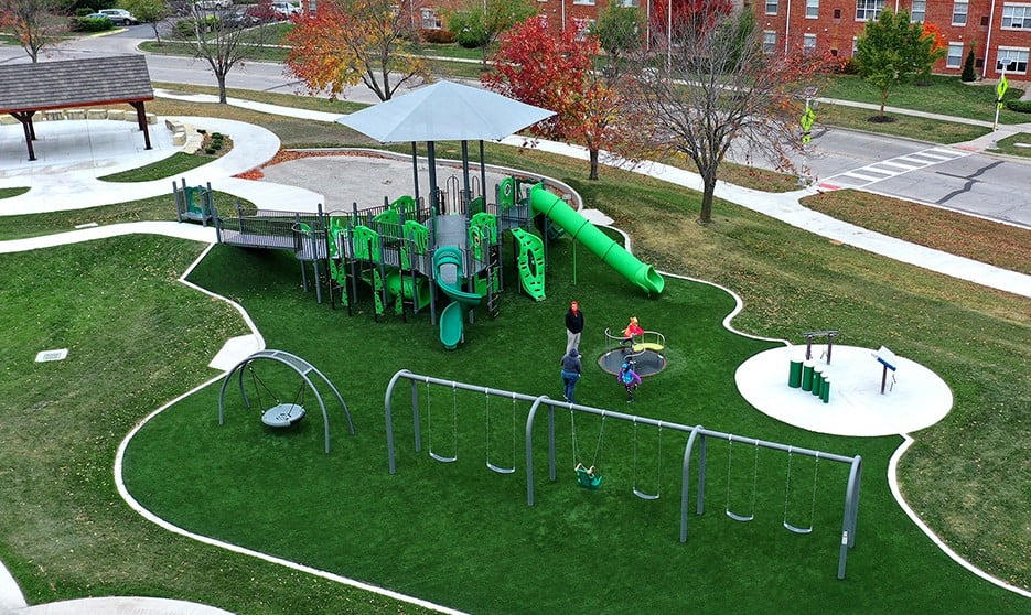 Featured image of Aerial view if Indian Creek Library Playground on green turf